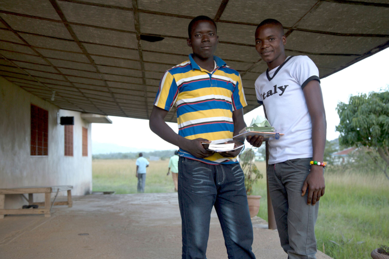 Two christian men on a porch - during break on youth camp